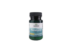 Swanson Melatonin tablet close-up showing a 3 mg dose for restful nights
