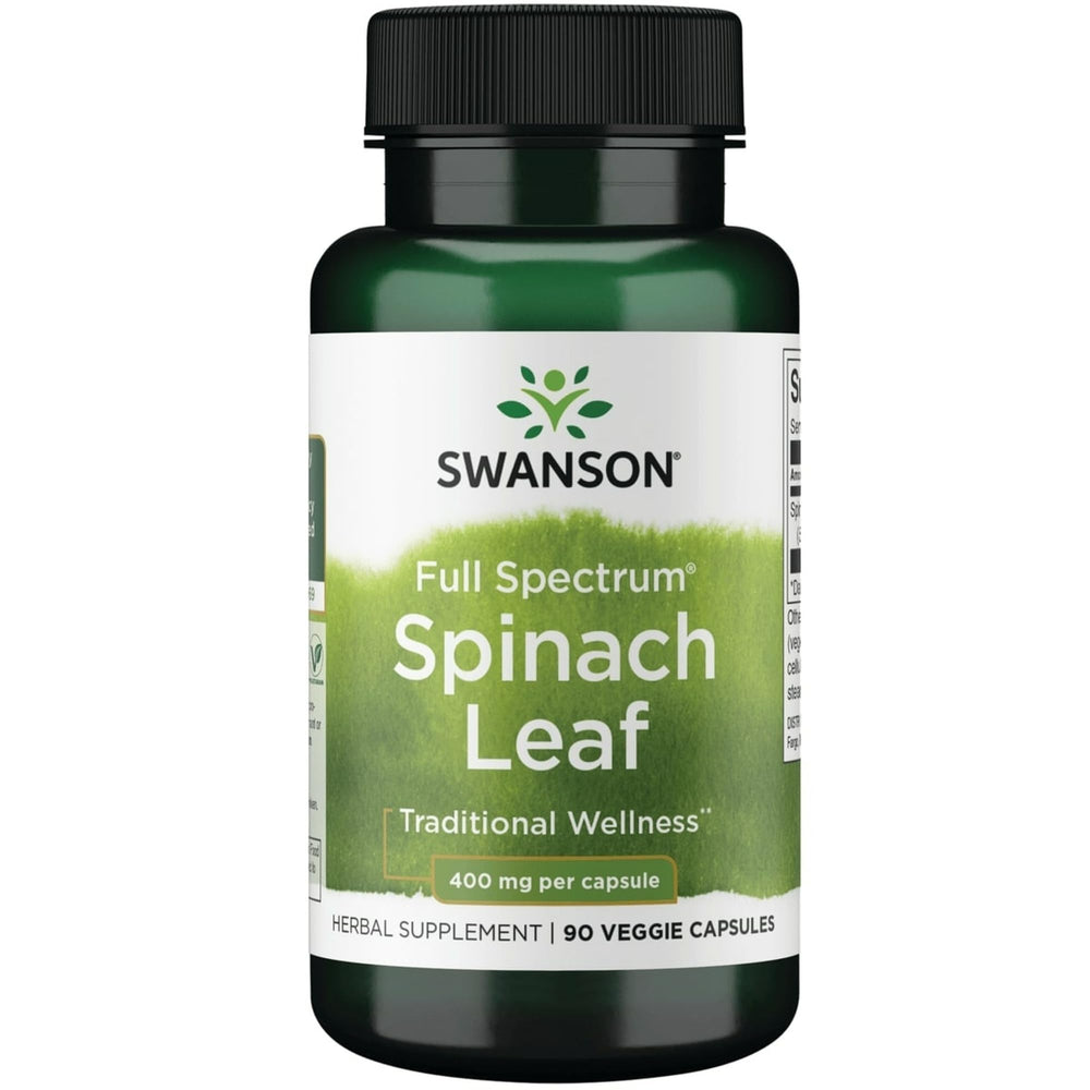 Swanson spinach leaf bottle close-up shows vegan capsules for simple daily nutrition.