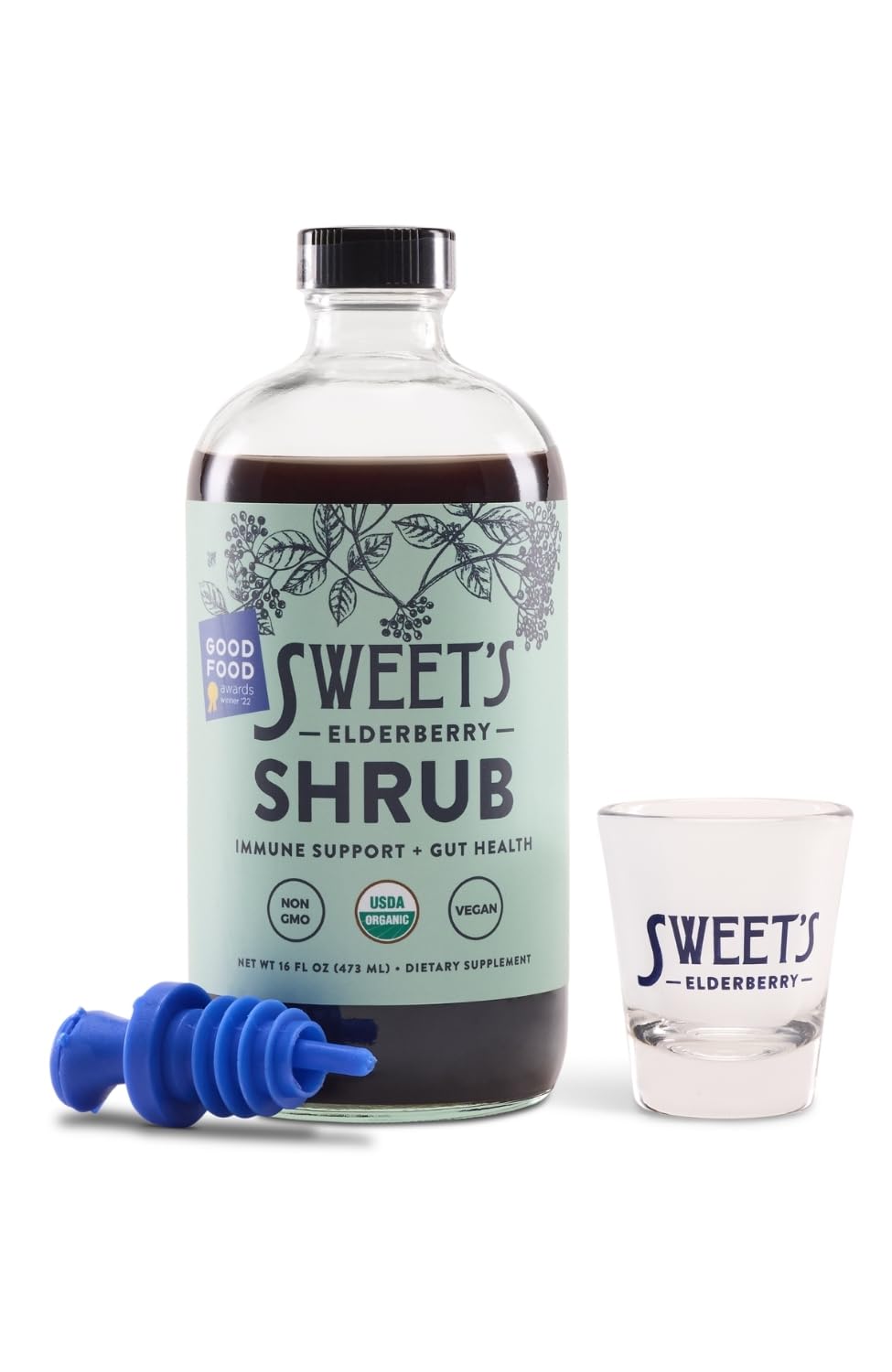 Sweet's Elderberry Shrub in a glass mocktail with vibrant color.