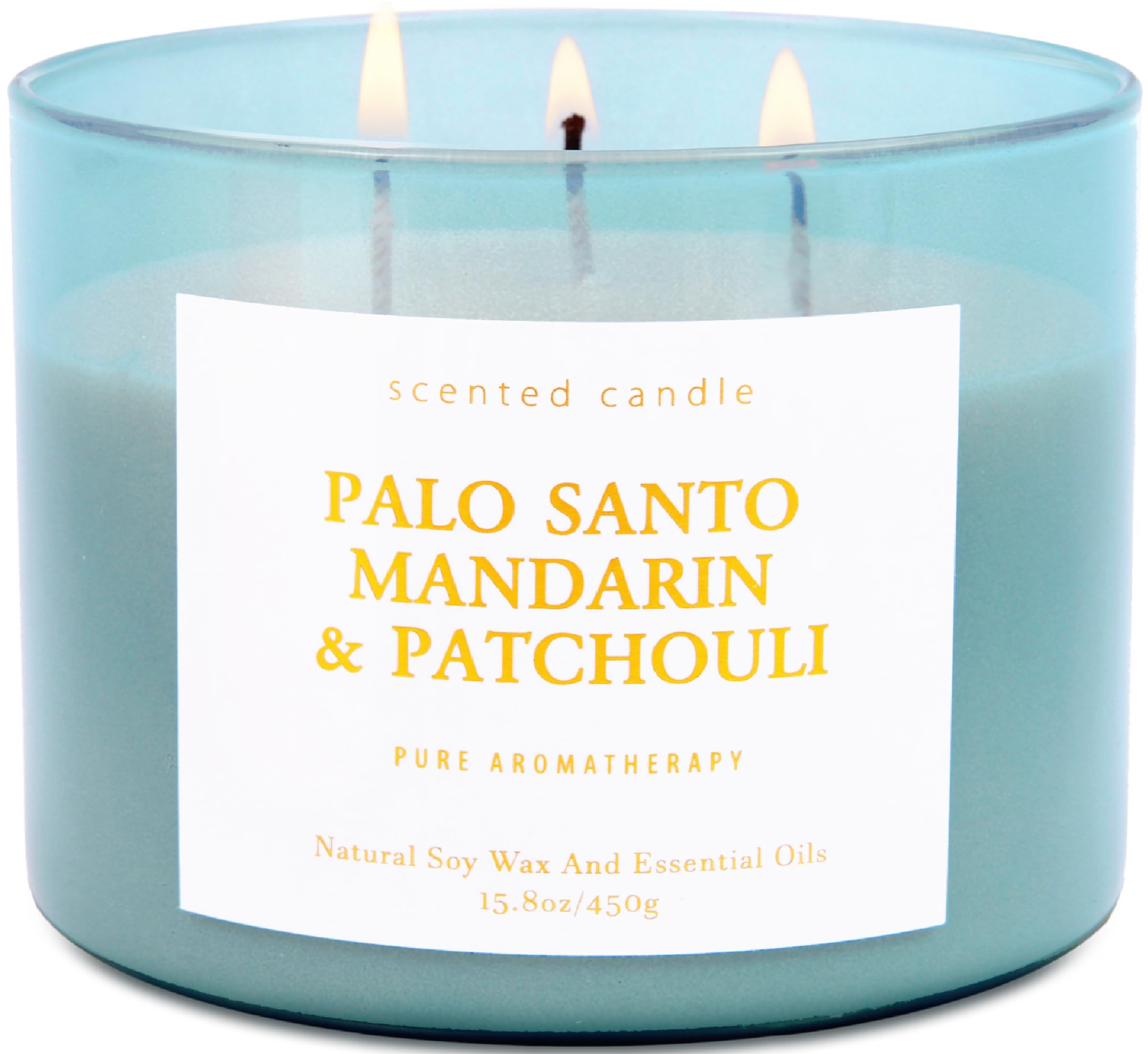 T&amp;H Palo Santo Mandarin Patchouli candle in blue jar close-up, calming ambiance.