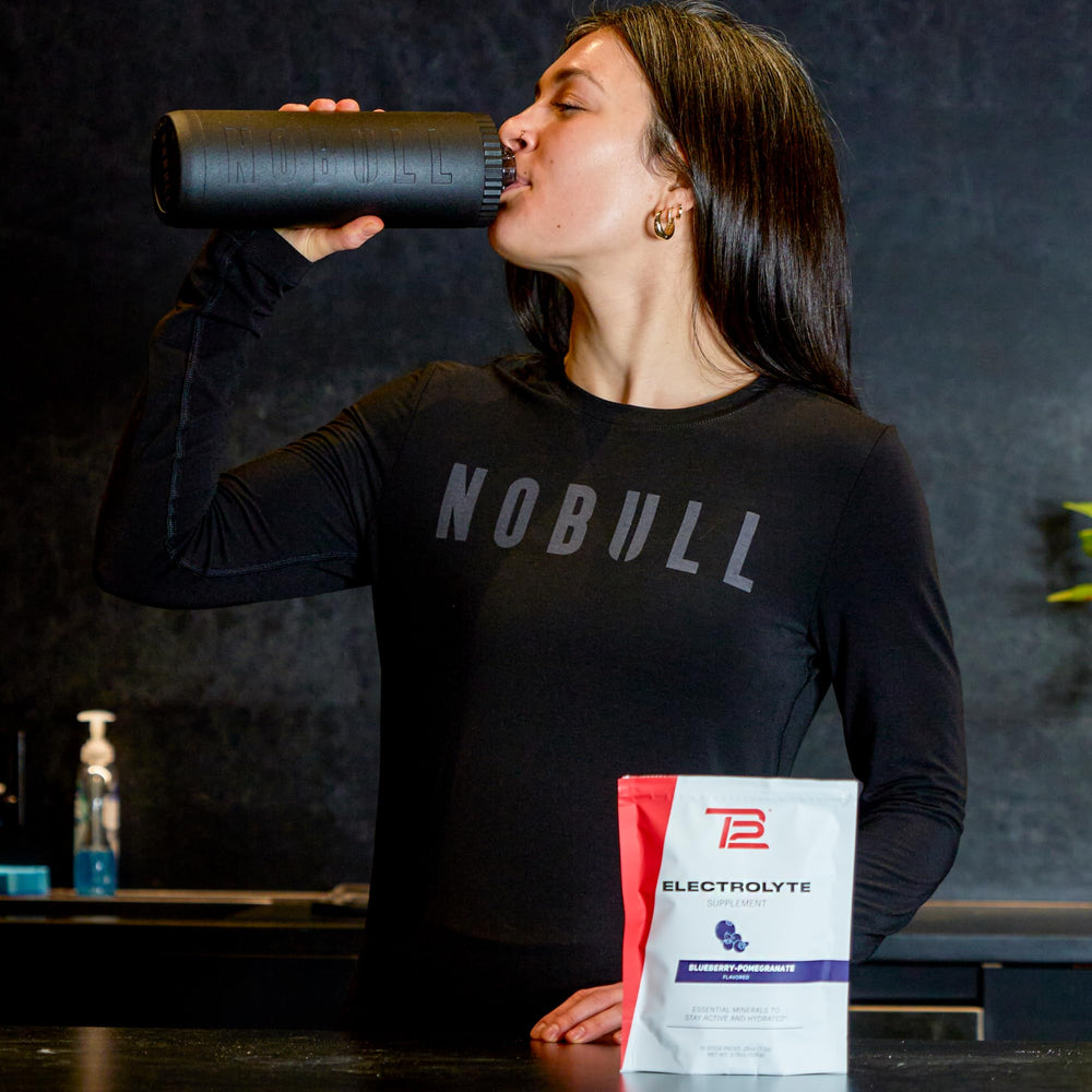 TB12 electrolyte powder on a gym bag for on-the-go hydration