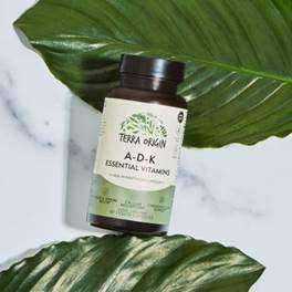 Terra Origin ADK Essential bottle being poured to show daily usage