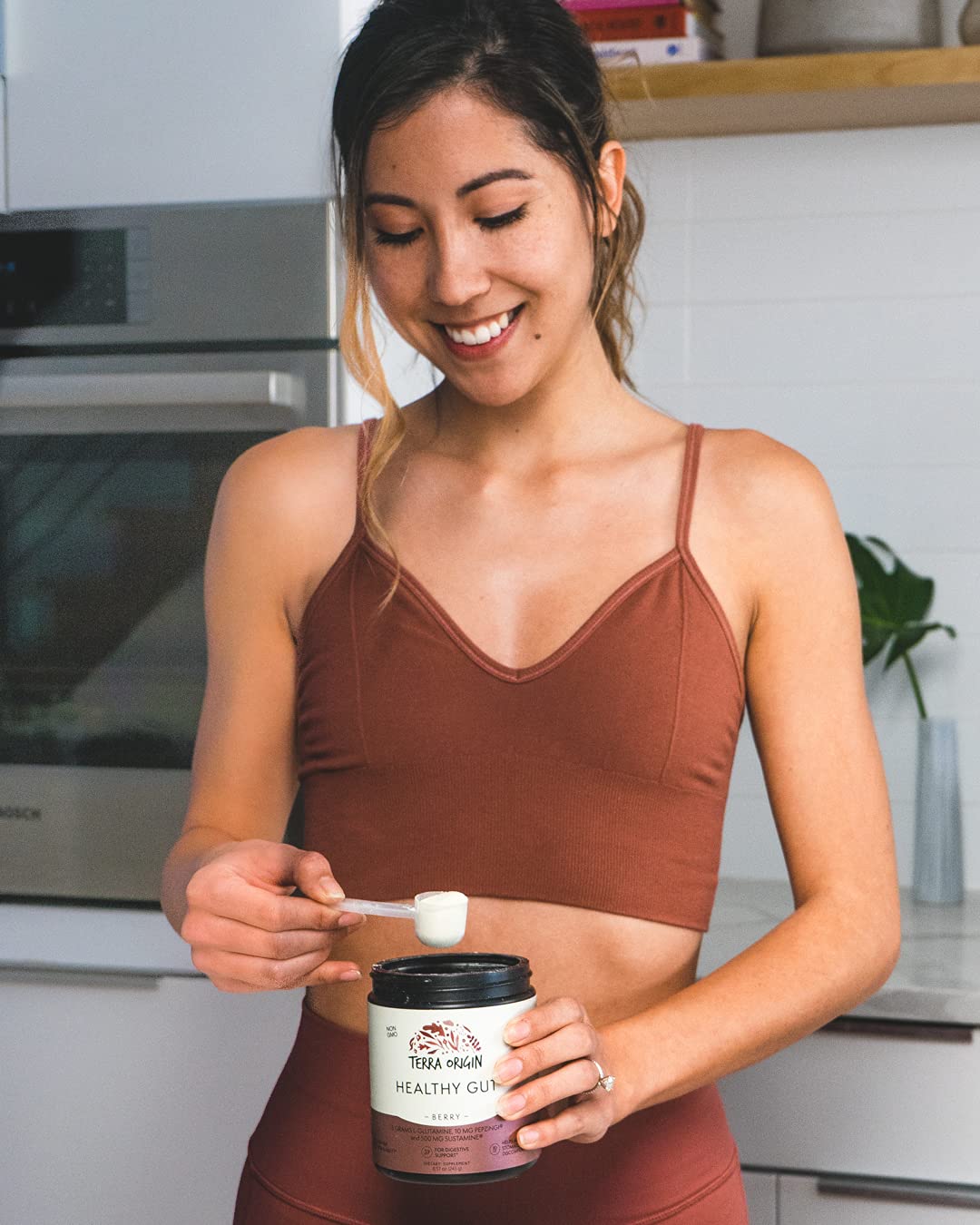 Terra Origin Healthy Gut Powder Berry packaging emphasizing non-GMO quality