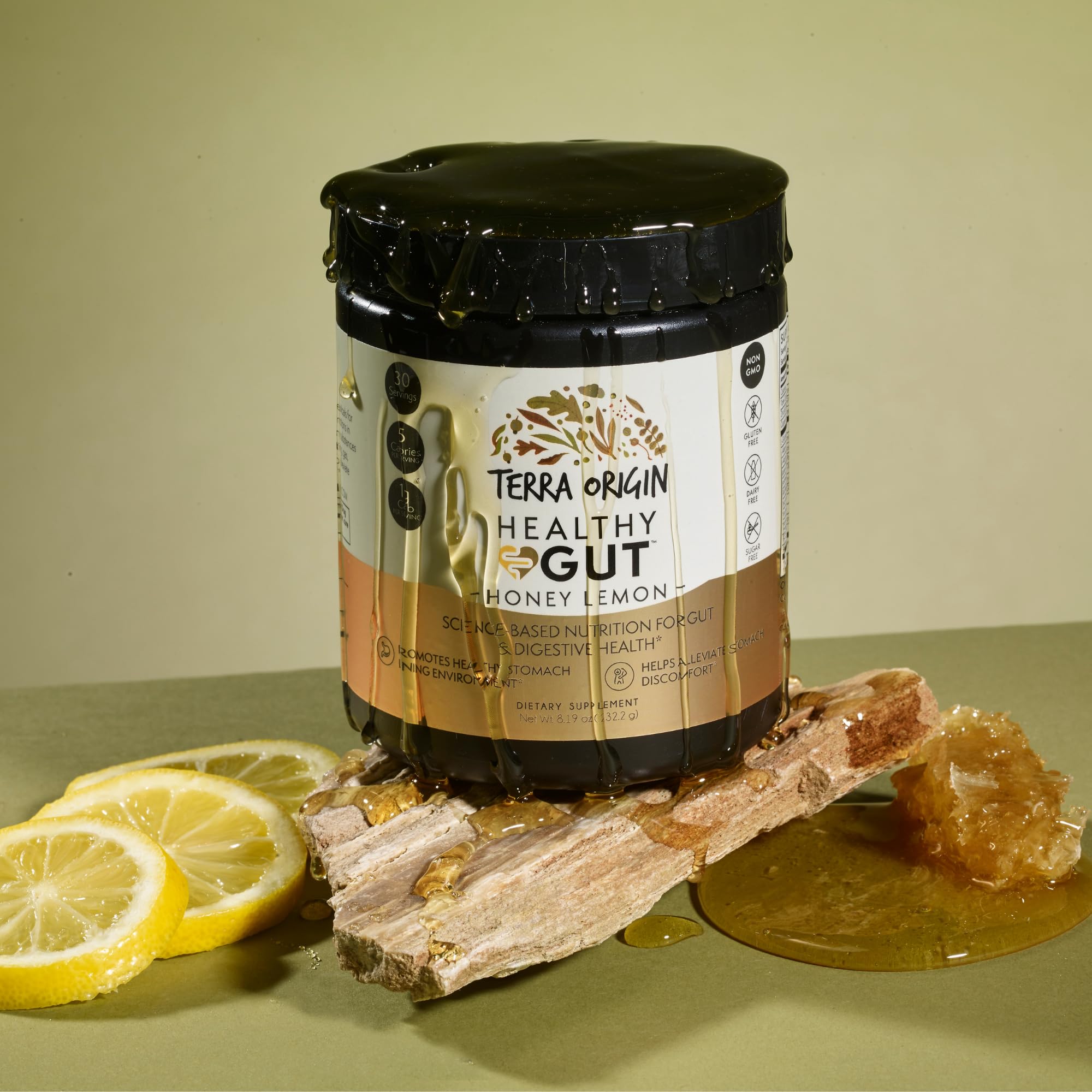 Terra Origin Healthy Gut Powder stirred in a glass of water for easy mixing.