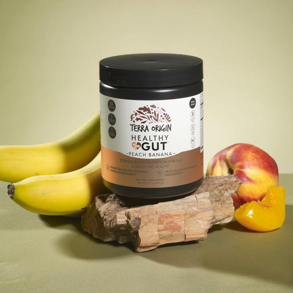 Terra Origin peach-banana shake in glass highlighting easy daily use.