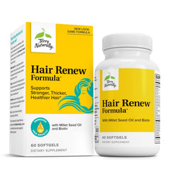 Terry Naturally Hair Renew Formula bottle on desk for daily hair nourishment.