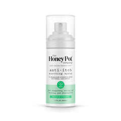 The Honey Pot Company feminine anti-itch spray bottle on bathroom counter for on-the-go relief.