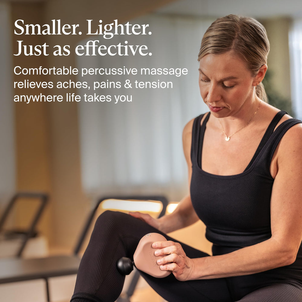 Theragun Mini standard ball attachment for full-body massage and tension release.