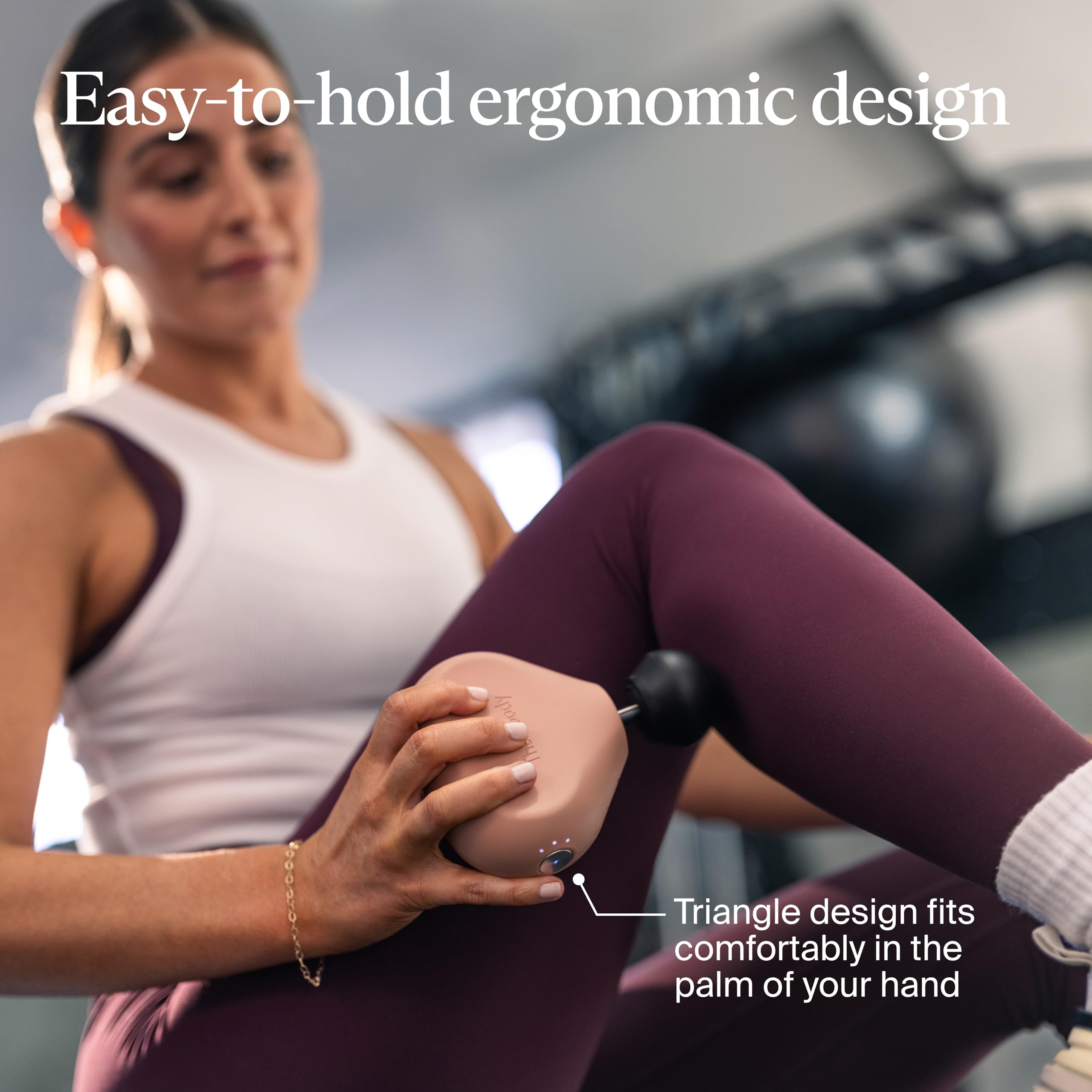 Theragun Mini with LED speed indicators guiding massage intensity.