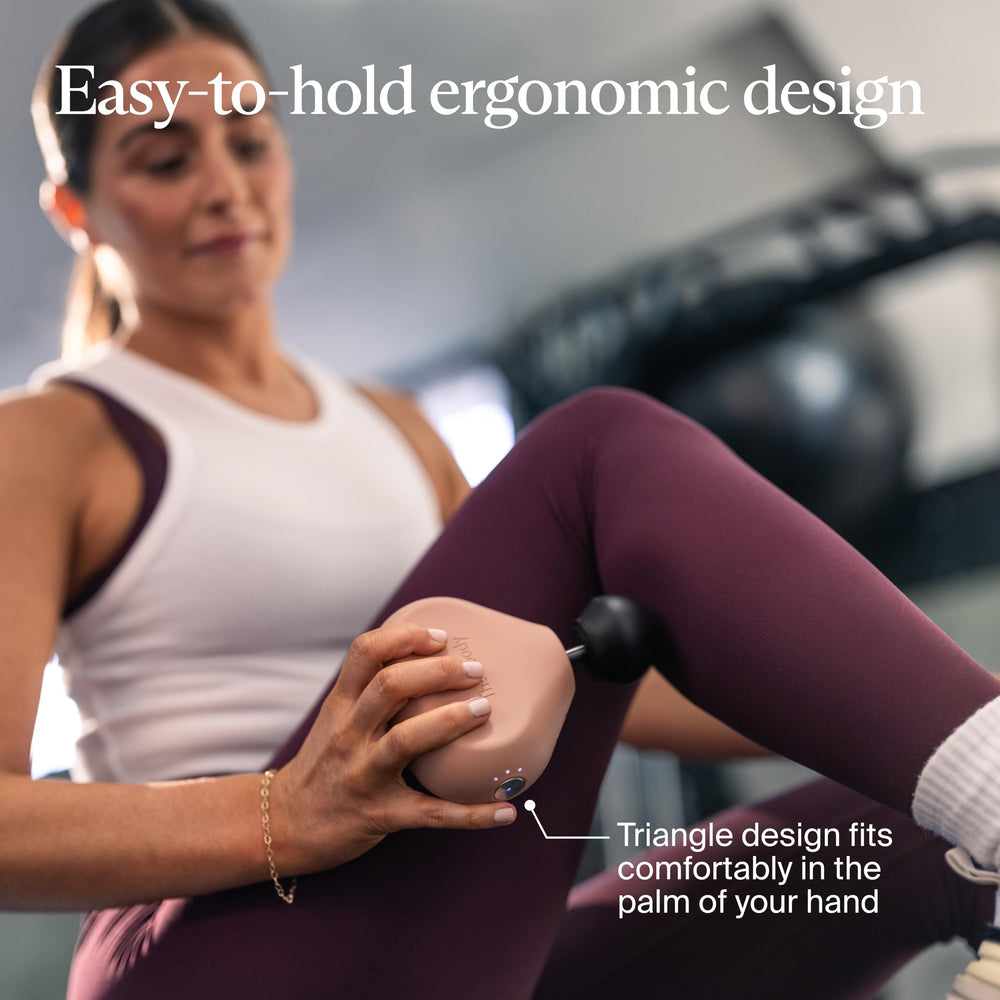 Theragun Mini with LED speed indicators guiding massage intensity.