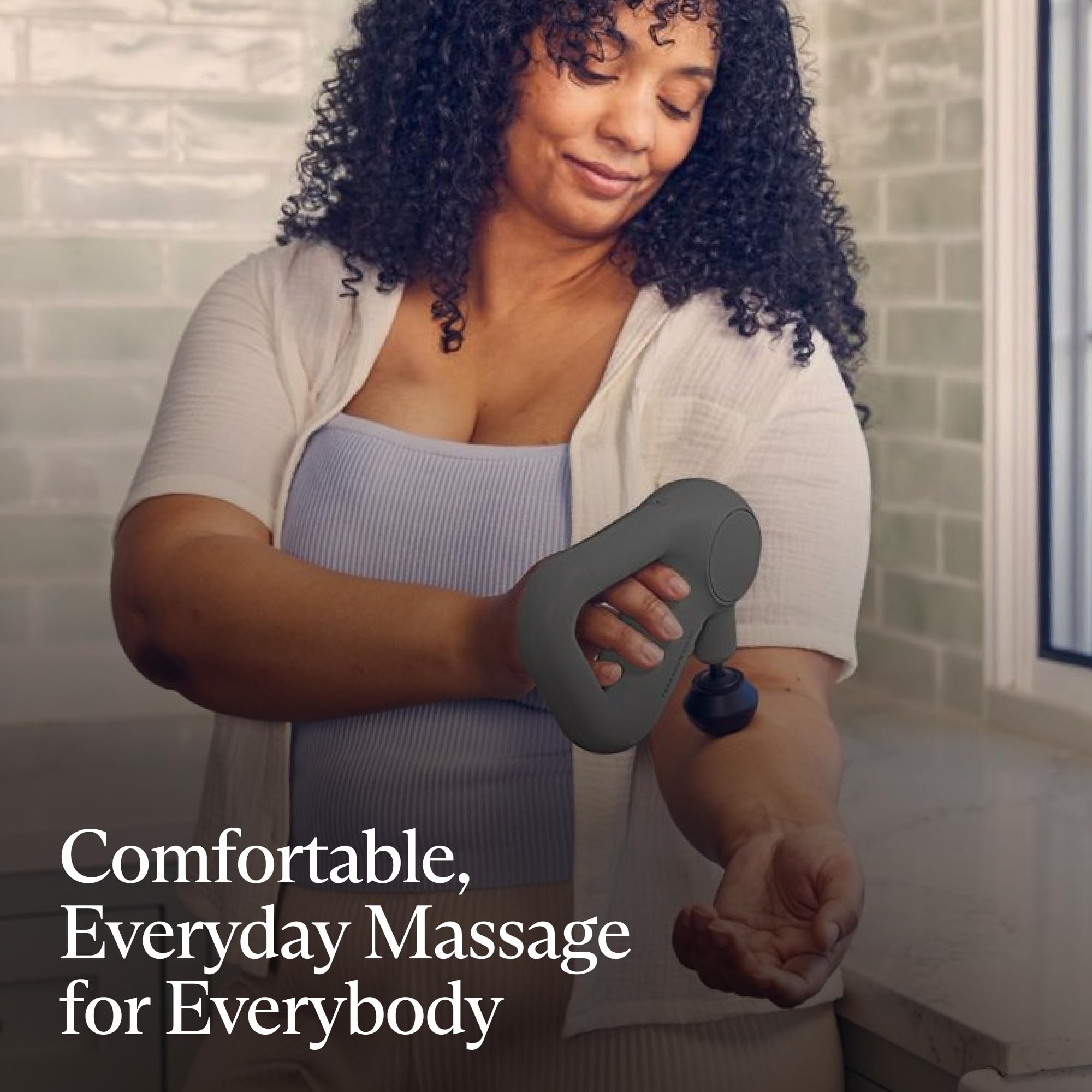 TheraGun Relief gray with three speed control for customizable massage