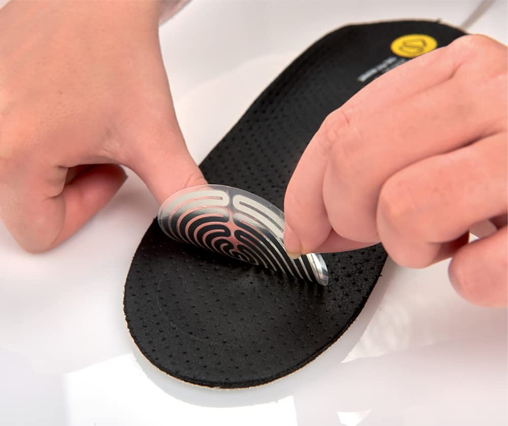 Therm-ic heated insoles inside a ski boot delivering reliable warmth