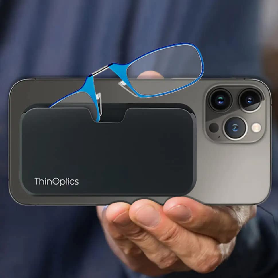 ThinOptics universal pod case attached to a phone keeps glasses within reach.