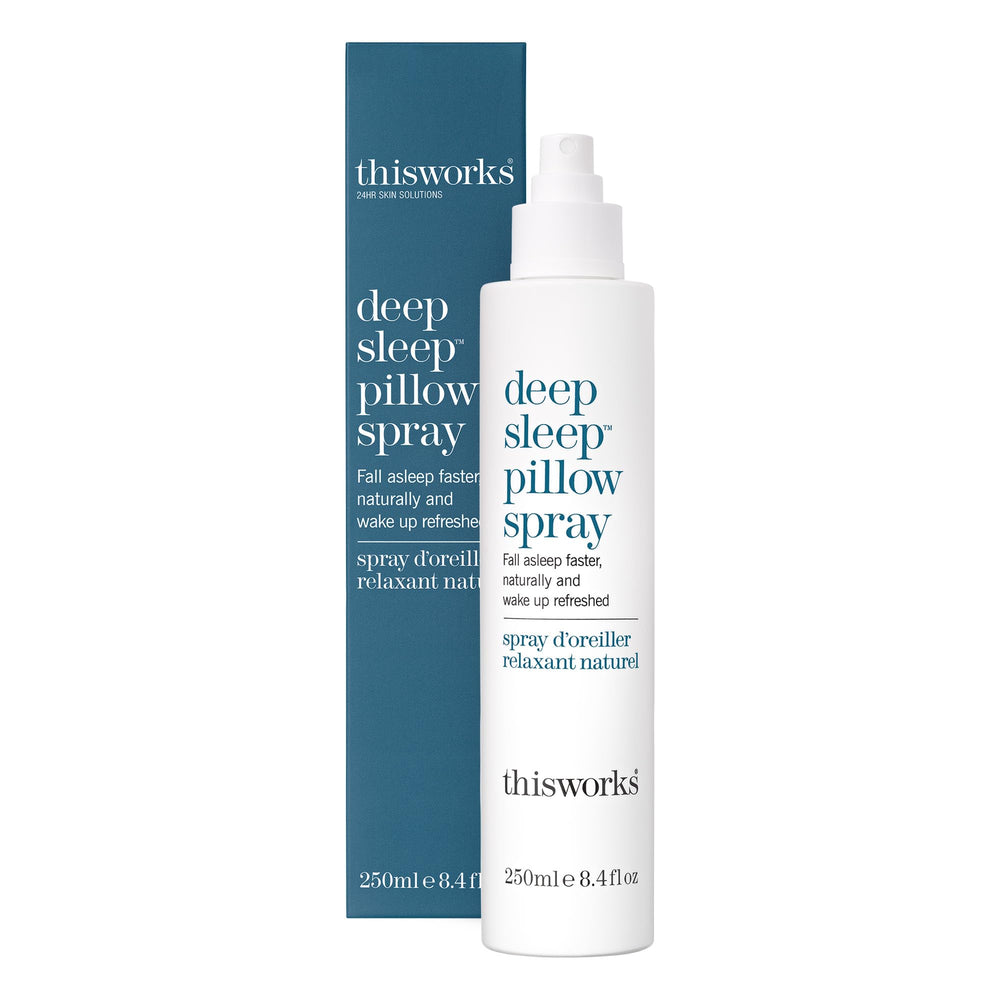 THISWORKS Deep Sleep Pillow Spray bottle on a nightstand for bedtime relaxation