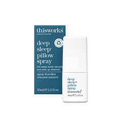 THISWORKS Deep Sleep Pillow Spray bottle on a bedside table for calming nights.