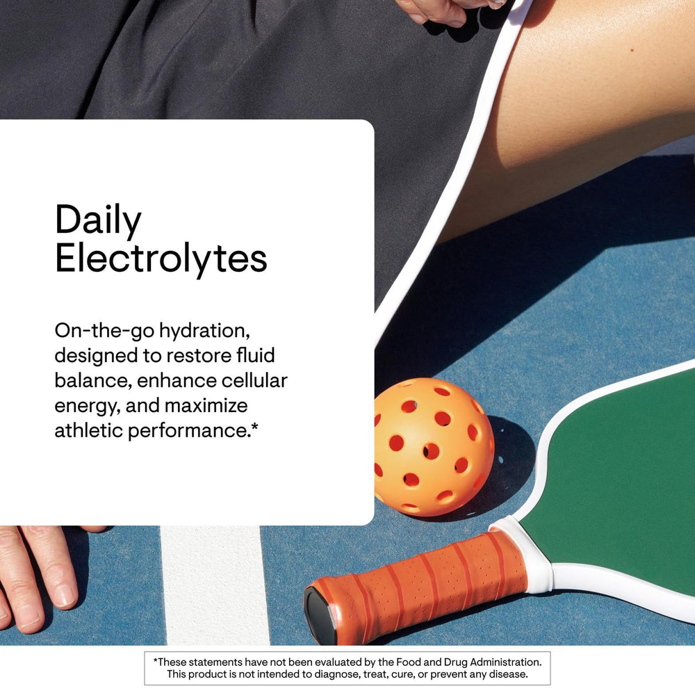 Thorne Daily Electrolytes powder dissolving in water for refreshing hydration.