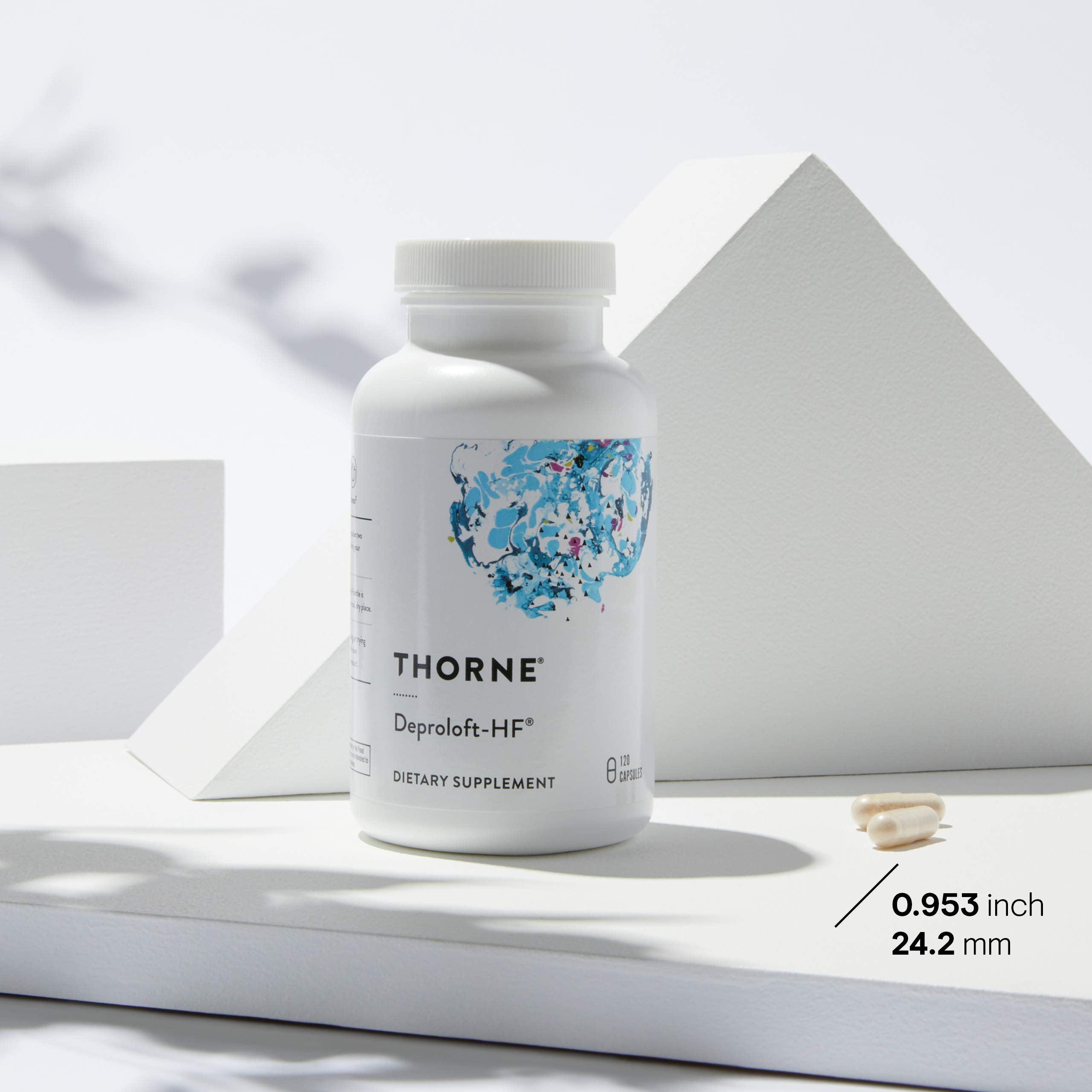 THORNE Emotion Balance bottle in hand suggesting portable daily balance.
