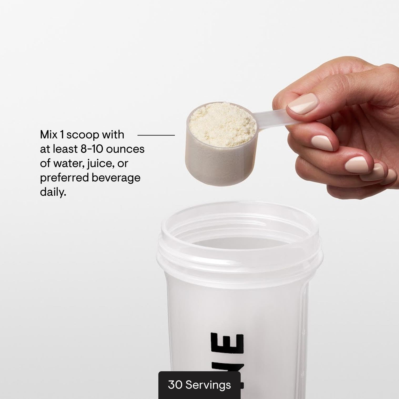 Glass of water with dissolving FiberMend powder showing mixability