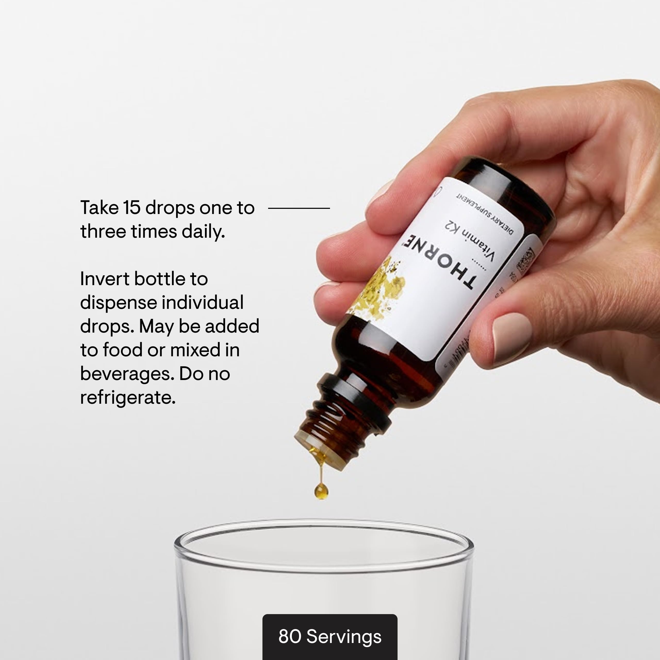 THORNE Vitamin K2 Liquid packaging with lab testing backdrop