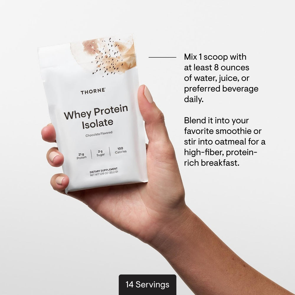 THORNE Whey Protein Isolate chocolate powder close-up aids precise mixing.