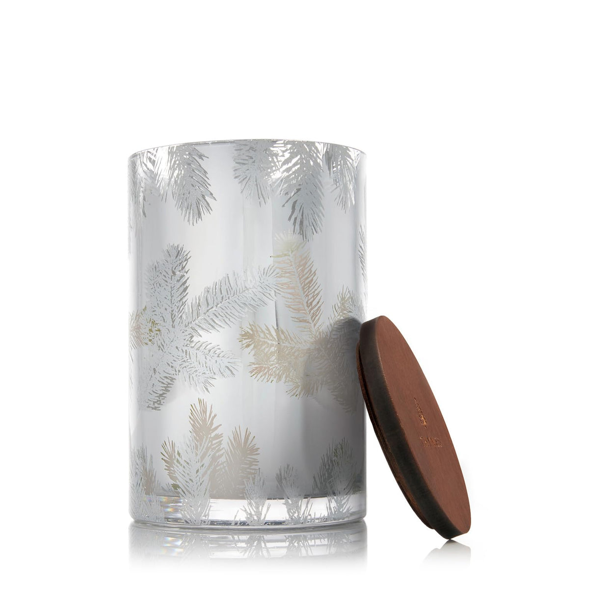 Thymes Frasier Fir candle with silver lid and pine needle design for elegant holiday ambiance