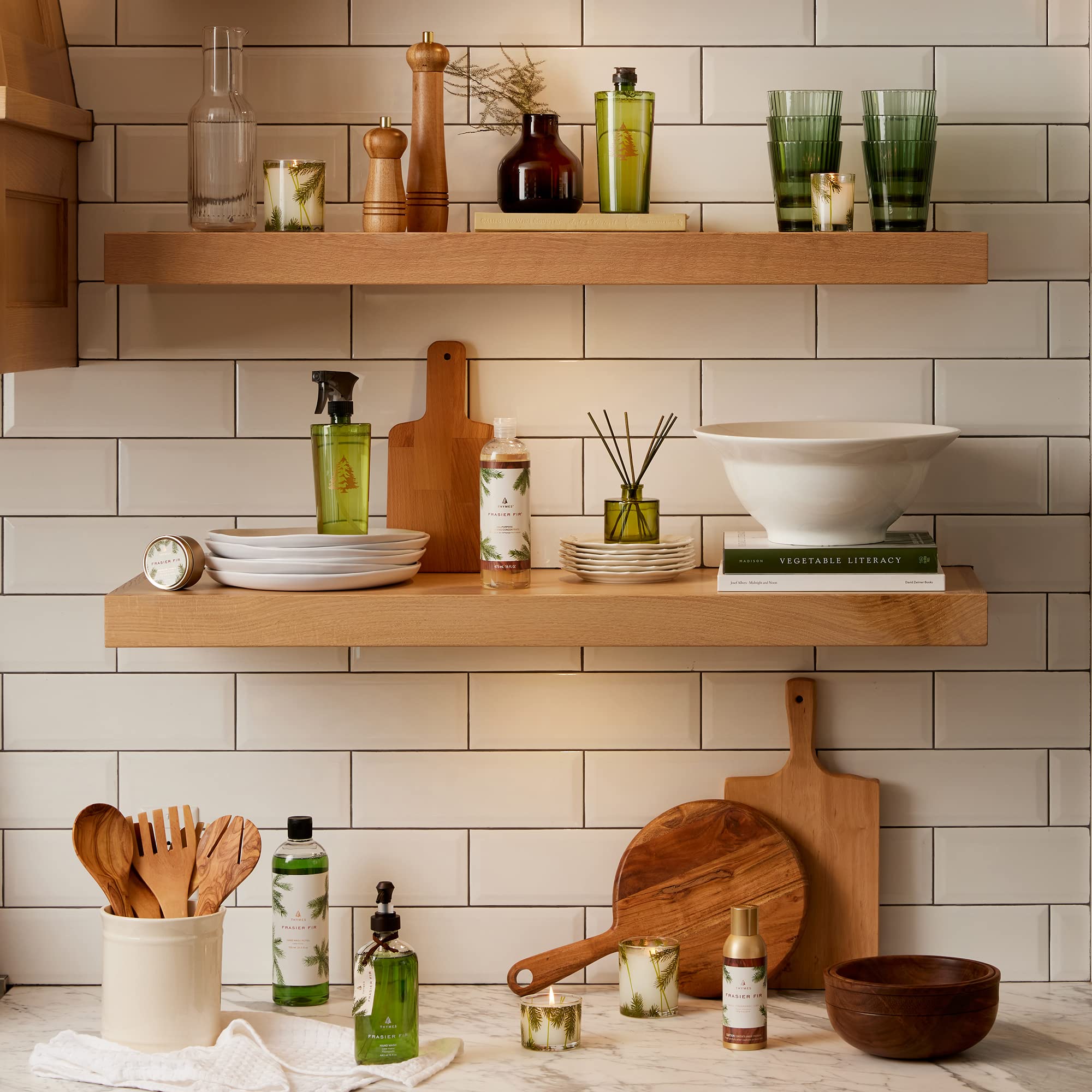 Thymes Travel Tin Frasier Fir in a cozy room setting, inviting scent.
