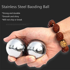Tianigo Baoding balls in hand demonstrating rotation for hand therapy and dexterity.