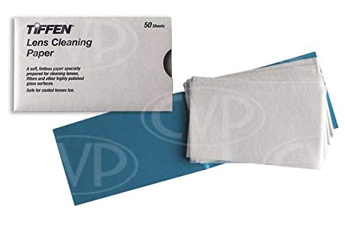 Tiffen lens cleaning tissue being used on a camera lens to remove smudges.