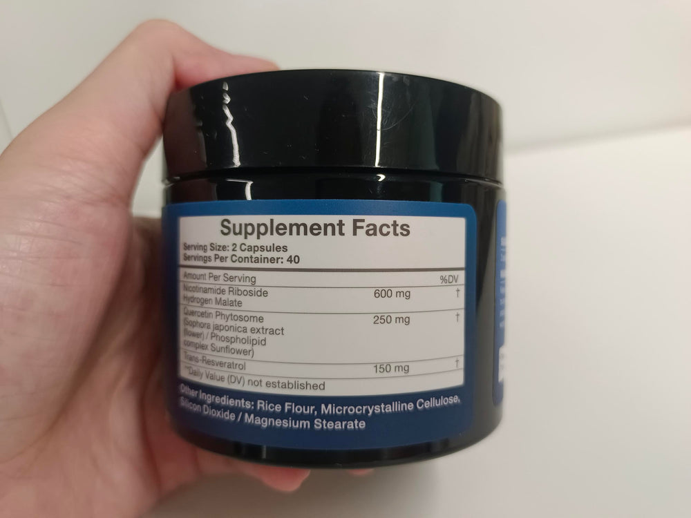 TOPCAPAK NAD+ 1000mg daily-use setup showing a user taking a capsule