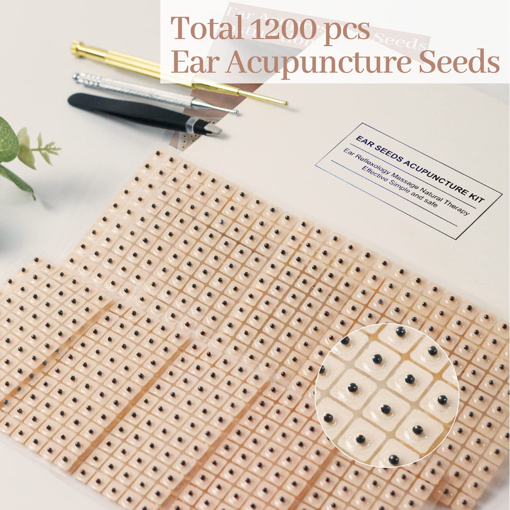 Tophld tweezers for clean placement of ear seeds.