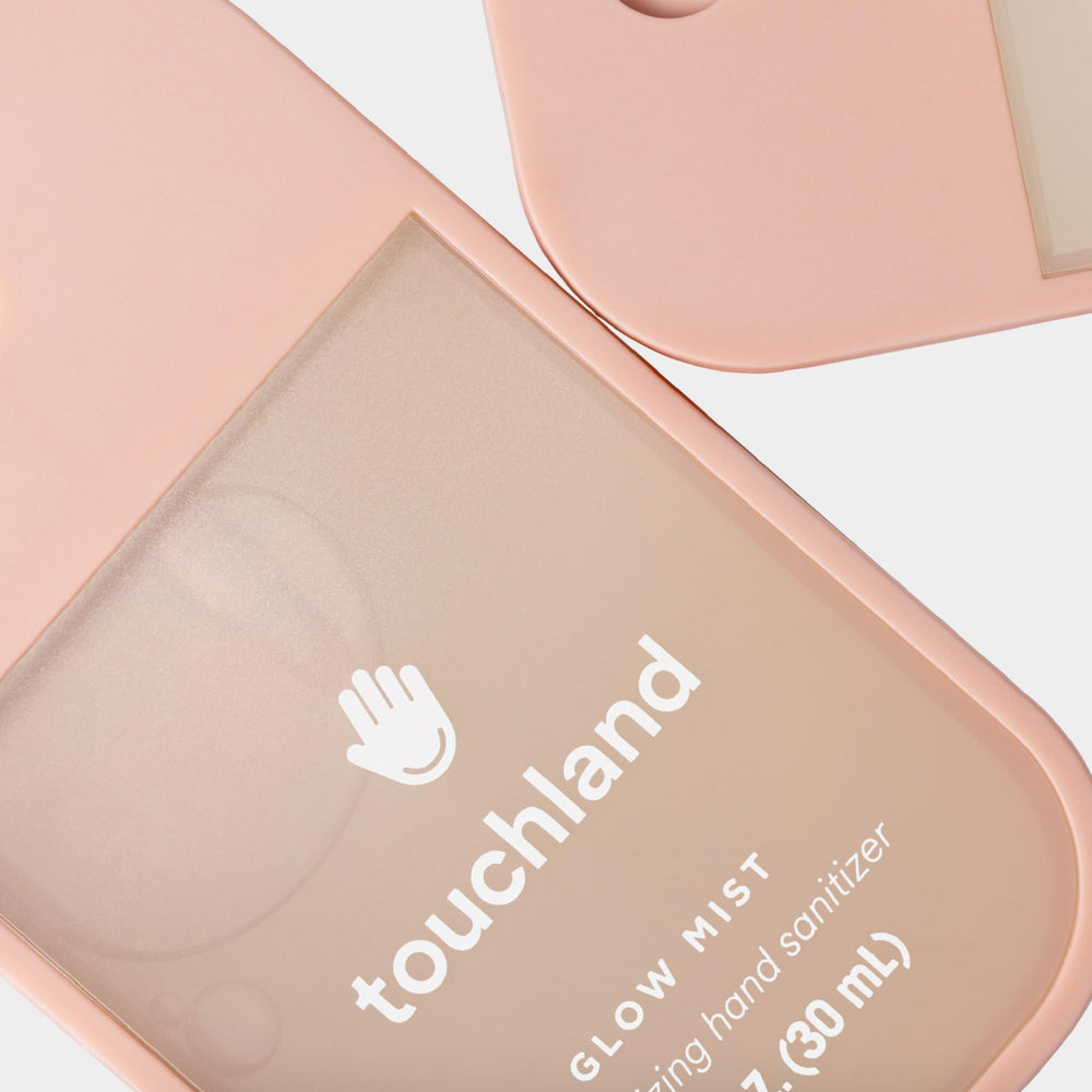 Touchland Glow Mist liquid close-up highlights a lightweight, fast-absorbing formula.