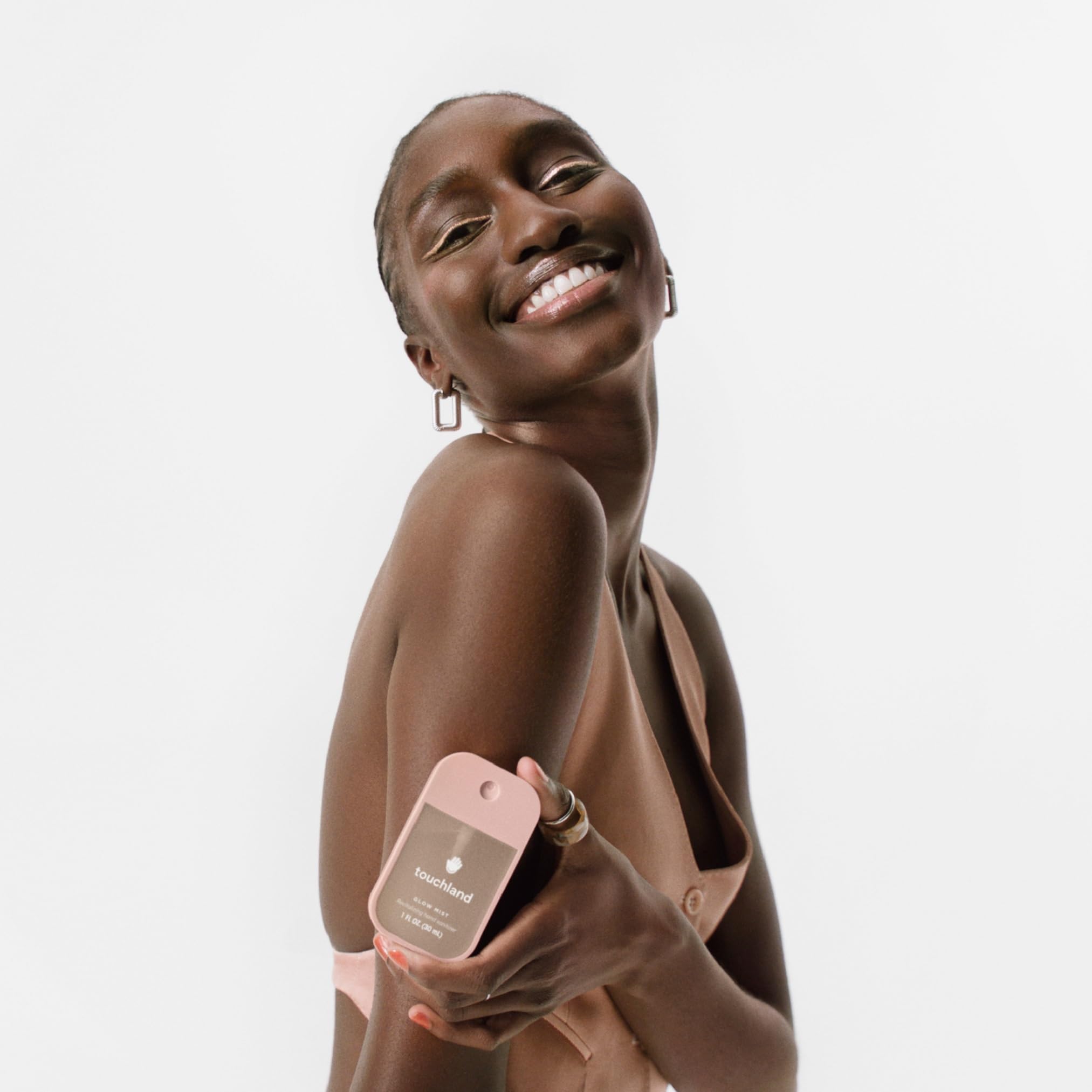 Touchland Glow Mist rosewater spray enables fast, light-absorbing application anywhere.