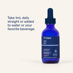 Trace Minerals Ionic B12 bottle beside a glass for convenient supplementation