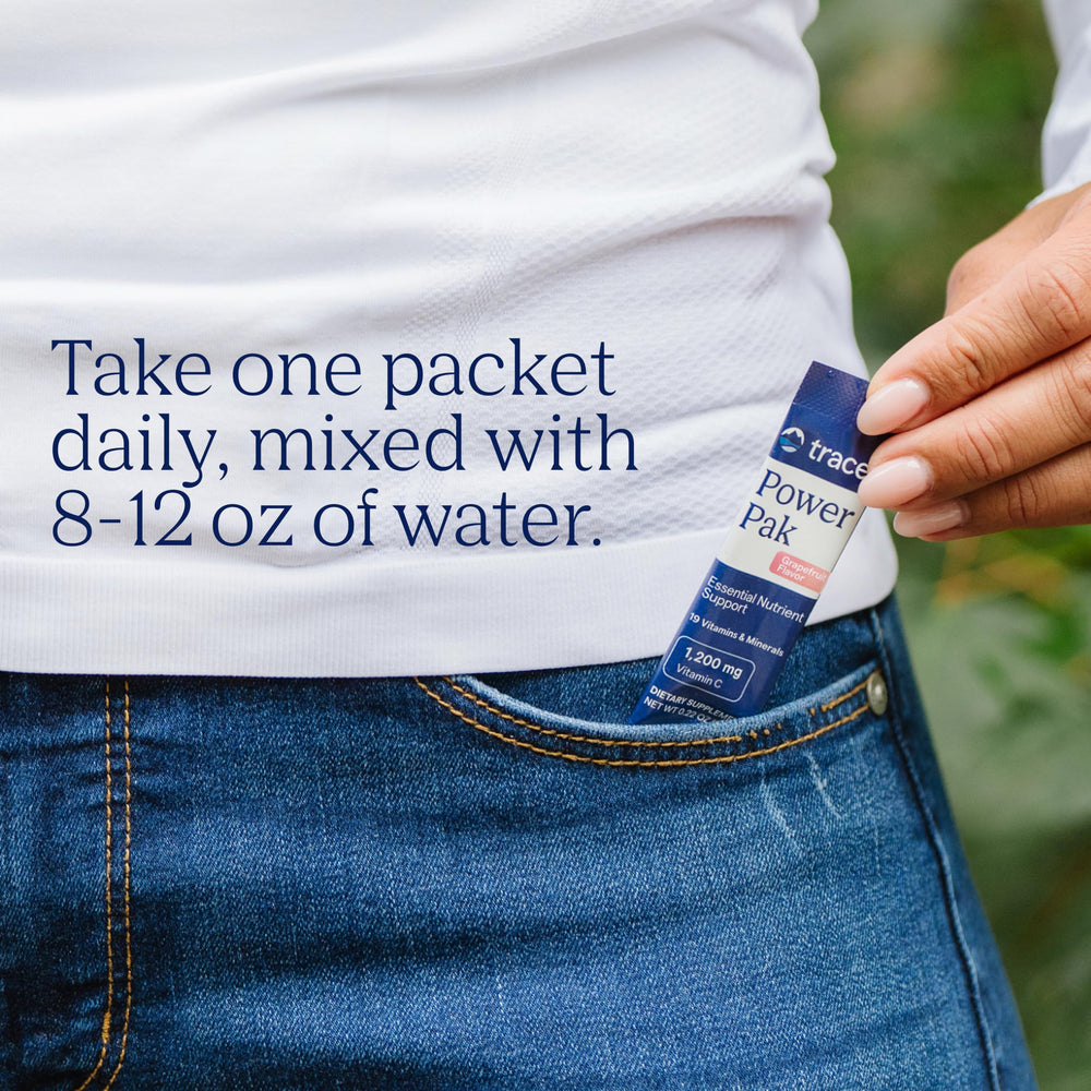 Power Pak packets pouring into a glass of water to dissolve