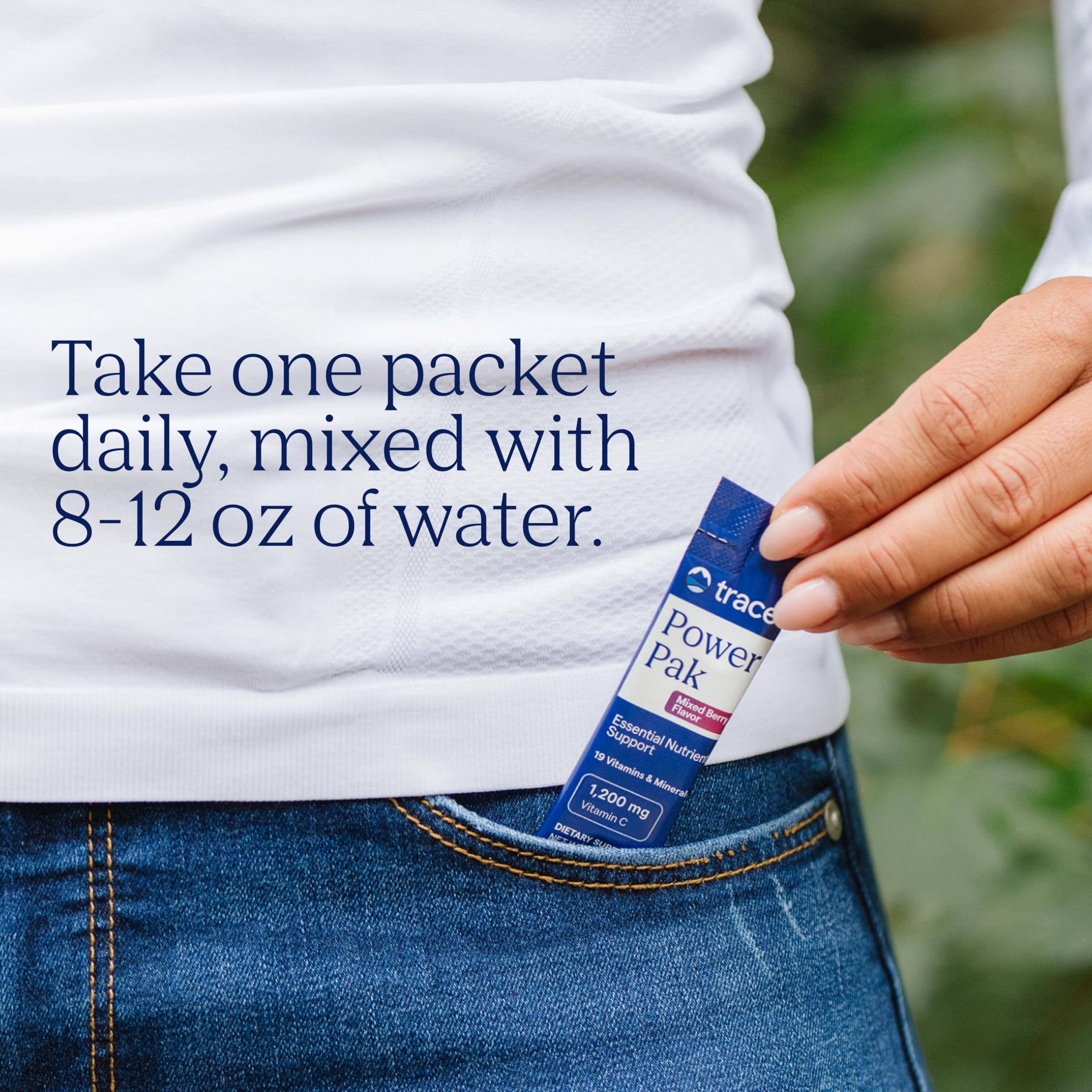 Trace Minerals Power Pak orange blast powder being poured into a shaker.