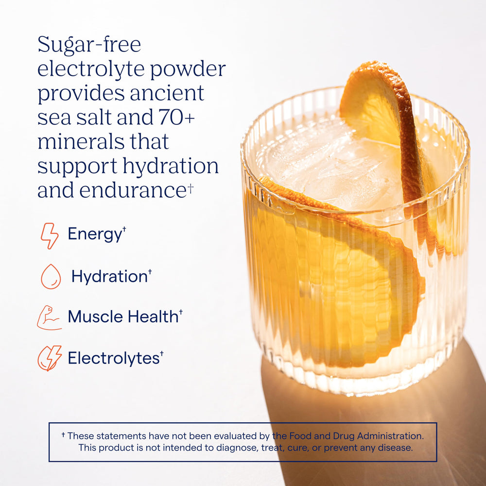 Trace Minerals ZeroLyte dissolving in water with a bright salty orange flavor.