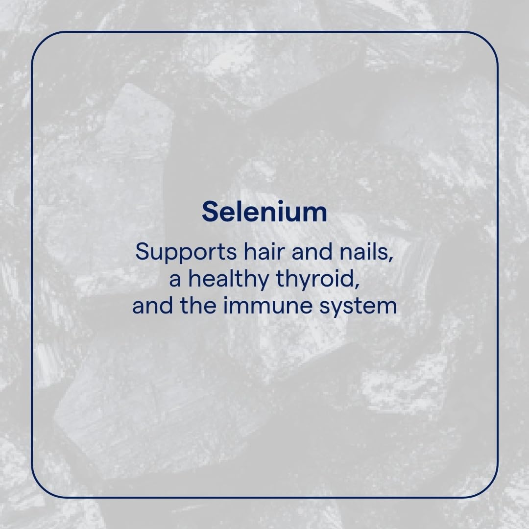 Close-up of metered dropper dispensing selenium solution for daily use