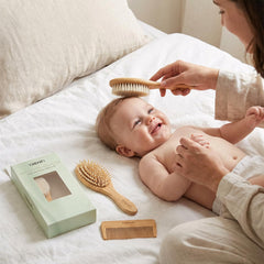TRENFI bamboo baby comb fine-tooth for gentle detangling.