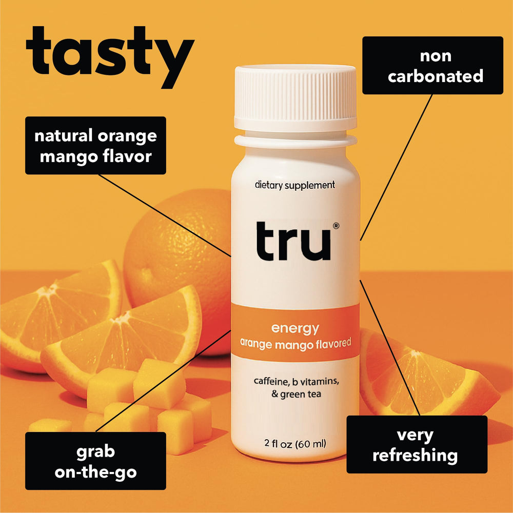 Tru Energy Shot being poured into a glass, showcasing convenient 2 oz size.
