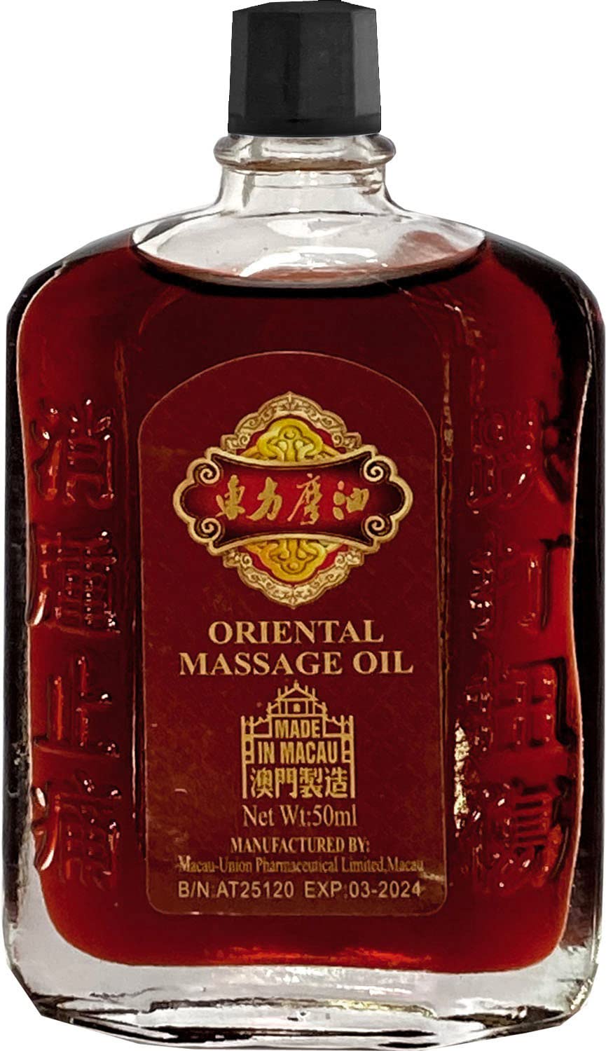 Applying UN HEI TONG Oriental Massage Oil to tense shoulders and back