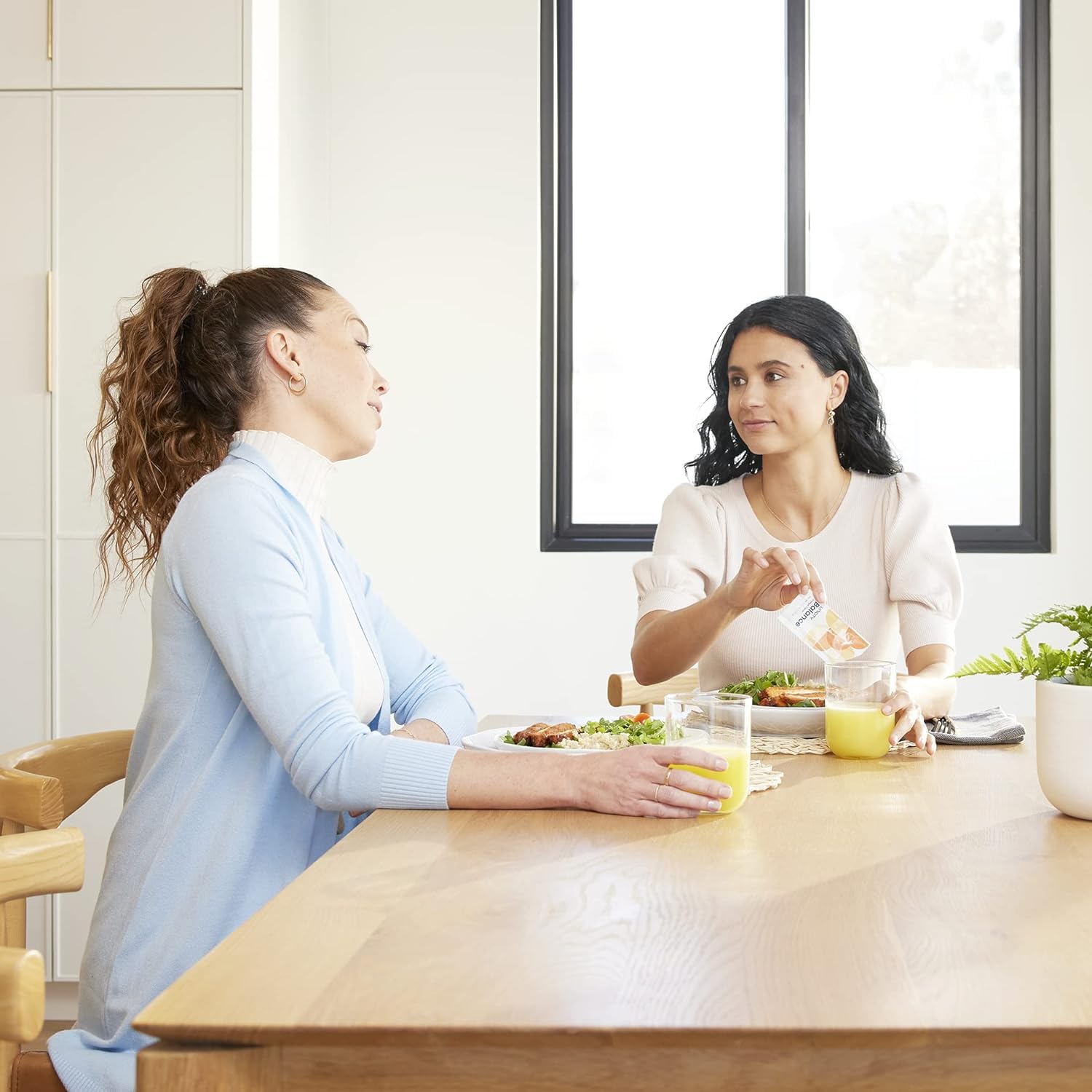 Active individual enjoying Balance Natural Orange between meals to manage cravings.
