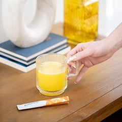 Balance Natural Orange powder mixing in a glass to slow carbohydrate absorption.