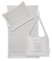UNMERA acupressure mat camellia nails close-up for soothing back tension and daily unwind