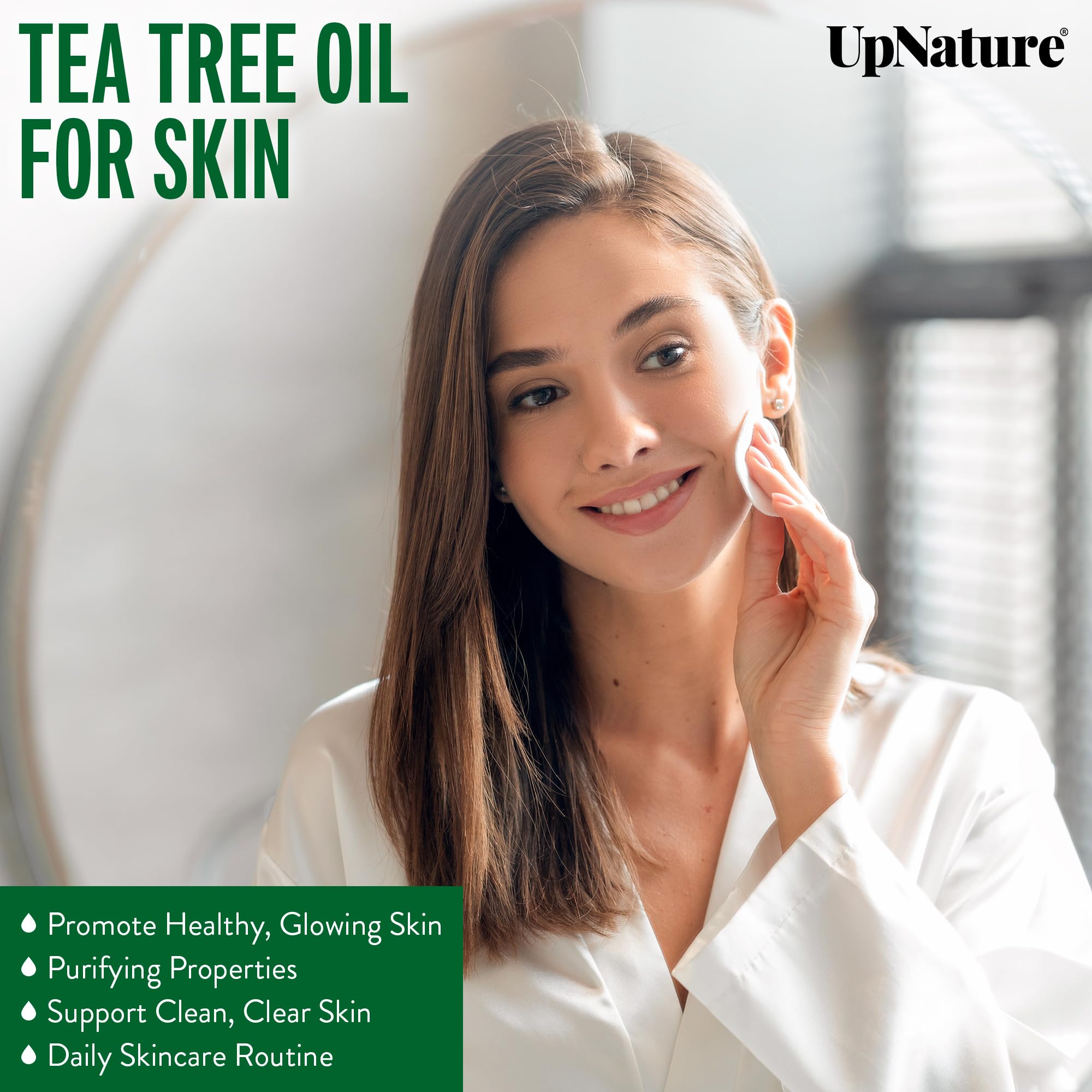UpNature Tea Tree Oil bottle close-up, showcasing purity for nourishing hair and scalp.