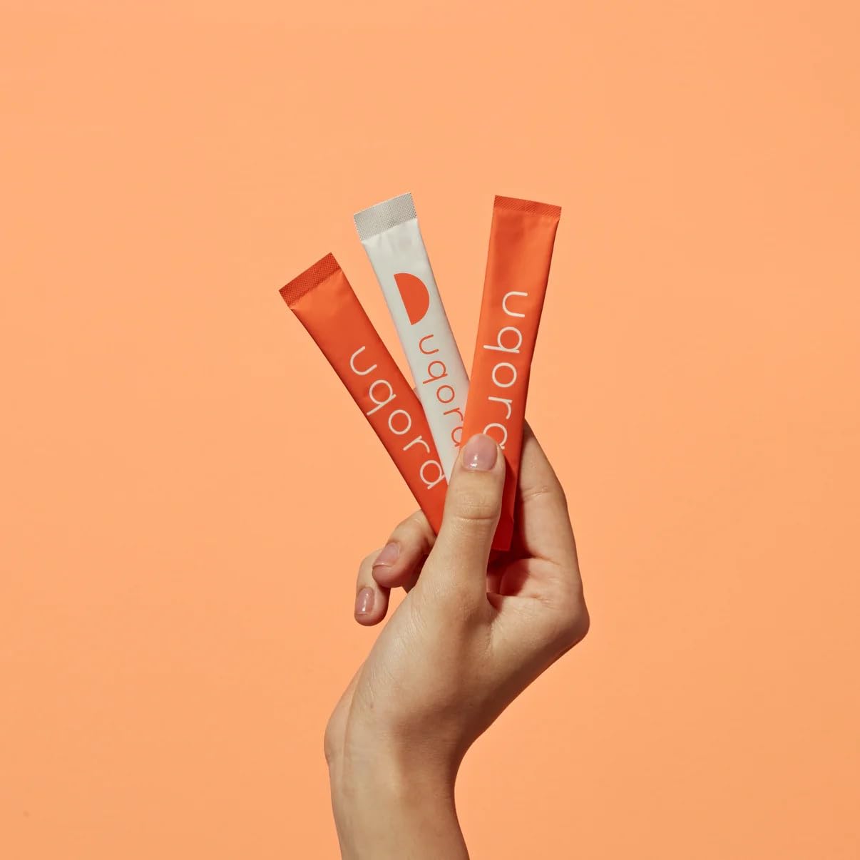 Pouring Uqora Flush into water demonstrates easy mixability for hydration.