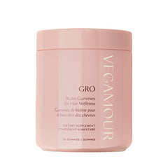 VEGAMOUR GRO Biotin Gummies bottle with strawberry flavor for daily hair wellness.
