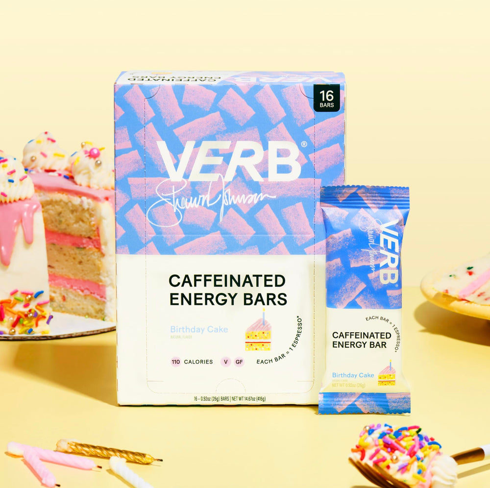 Verb Caffeinated Energy Bar Birthday Cake on-the-go setup beside a laptop for sustained focus.