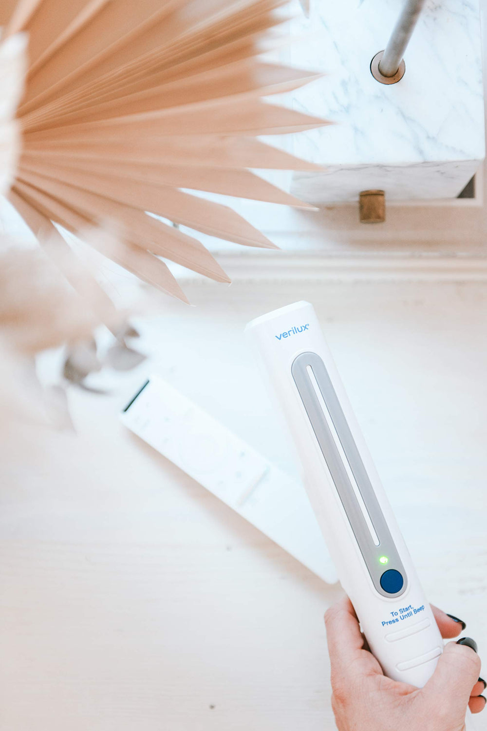 Verilux CleanWave VH03 portable wand fits purse or briefcase for quick sanitizing tasks.
