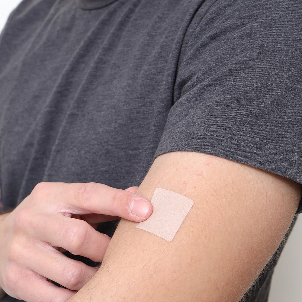 Close-up of Veru Wellness B12 Energy Patch adhered to skin for energy.