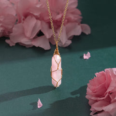 VIBILIA Rose quartz point pendant on a 20-inch adjustable chain.